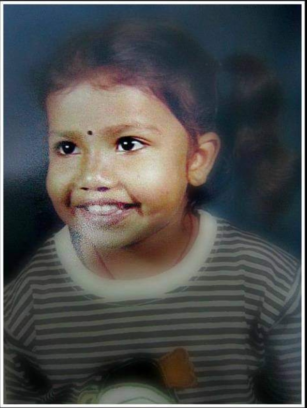 Shreya Subhashree Smiling Childhood.jpg