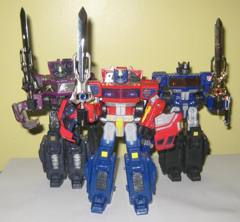 Double Shattered Glass Konvoy, Optimus Prime and Blue Konvoy with Prime Swords